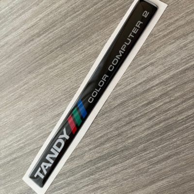 Tandy TRS-80 Color Computer 2 silver sticker badge domed